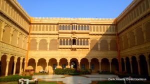 Central courtyard & musician at Suryagarh Jaisalmer